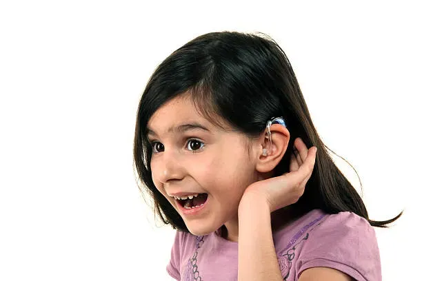 Child wearing a hearing aid